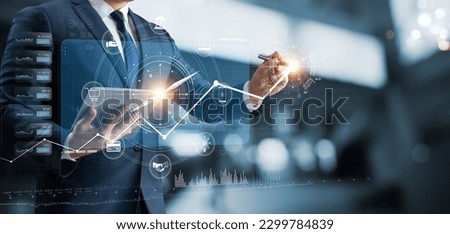 Businessman using tablet analyzing business growth graph data and progress, compass of navigate guiding market direction. Investment, banking and finance, business strategy. Global economy. Royalty-Free Stock Photo #2299784839