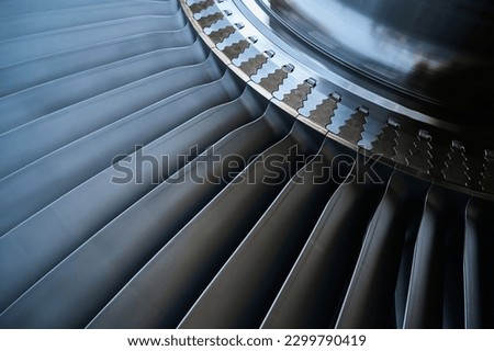 The rotor blades of a modern turbine, a close-up shot of the roots of long blades Royalty-Free Stock Photo #2299790419