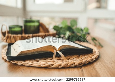 Open Bible in the home interior, morning reading.