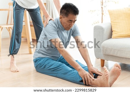 Japanese couple wearing sportswear in the living room