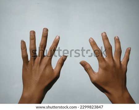 concept photo of finger showing surrender sign with both hands open up