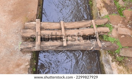 Small wooden bridge over the river. For background