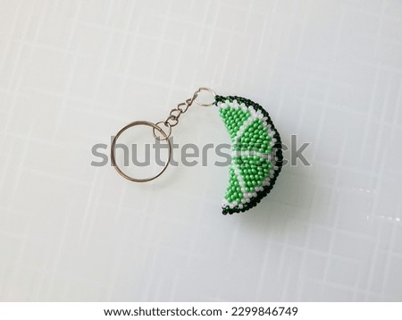 Bright key chain on a white. Fruit key chain on a white background