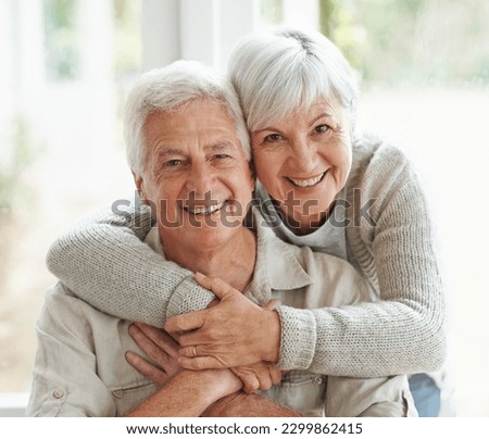 Portrait, smile and senior couple with love, hug and romance with retirement, relationship and bonding. Face, happy mature woman and elderly man embrace, home and marriage with commitment and loving Royalty-Free Stock Photo #2299862415