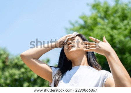 Front view portrait of a stressed teen suffering heat stroke  Royalty-Free Stock Photo #2299866867