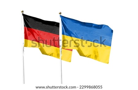 Flags of Germany flag and Ukrainian flag. Waving in blue sky