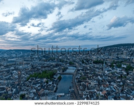 Aerial view over Swiss City of Zürich direction north on a beautiful spring evening with colorful dramatic sky. Photo taken May 6th, 2023, Zurich, Switzerland.
