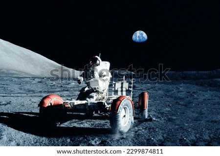 Astronaut on a lunar rover, on the moon. Elements of this image furnishing NASA. High quality photo