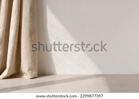 Neutral modern empty room with sunlight shadow, white blank wall background, beige linen curtain, stone floor or tabletop, aesthetic minimalist interior design template Royalty-Free Stock Photo #2299877397