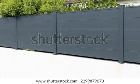 wall grey aluminum barrier and gray fence steel of private individual house modern new protect view home garden Royalty-Free Stock Photo #2299879073