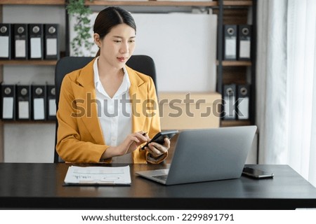 Business woman hand Project manager working and update tasks and Gantt chart scheduling virtual diagram.with smart phone, tablet and laptop in office.