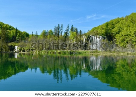 View of Gradinsko jezero lake and Prštavac waterfall at Plitvice lakes nation park in Lika-Senj county, Croatia with a reflection in the water in summer Royalty-Free Stock Photo #2299897611