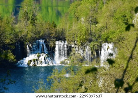 Waterfalls flowing from Kozjak to Malinovac lakes at Plitivice lakes in Lika-Senj county, Croatia in summer  Royalty-Free Stock Photo #2299897637