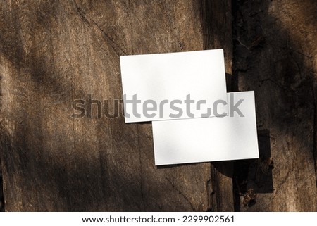 Blank white business card mockup on wood background. For your business card design. Corporate Stationery, Branding Mock up