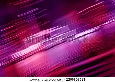Speed motion blur abstract background. Night city neon lights lines in motion defocused blurry background.
