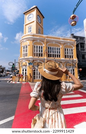 Young woman traveler walking at Phuket old town in Thailand Royalty-Free Stock Photo #2299911429
