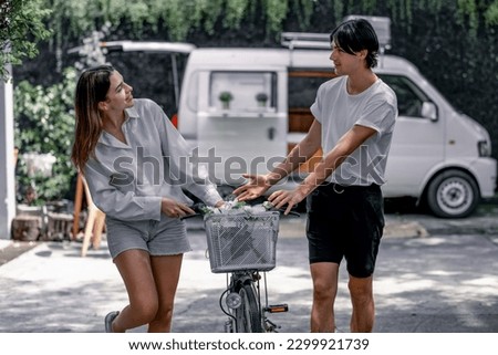 The soon-to-be life partners ride their bikes together. A young adult couple's romantic love, caring, and devotion. Long association and mutual understanding enhance the growth of a close relationship