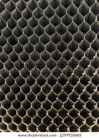 The honeycomb filter is made of black plastic.
