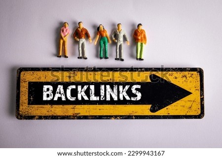 Backlinks. Direction sign and miniature human figures on a white background.