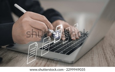 Concepts of practices and policies Company articles association forTerms and Conditions : Businessman using stylus pen to select electronic document on a digital document in a virtual screen to read. Royalty-Free Stock Photo #2299949035