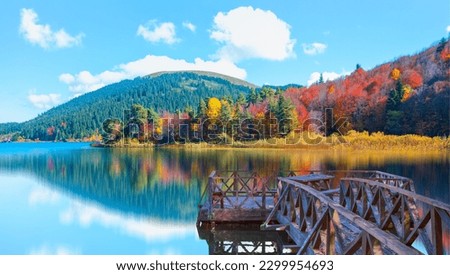 Abant Lake - Autumn forest landscape reflection on the water with wooden pier - Abant National Park - Bolu, Turkey