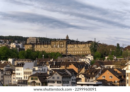 Scenic view of the old town of Zürich with University building of Swiss Federal Institute of Technology on cloudy spring evening. Photo taken May 6th, 2023, Zurich, Switzerland.