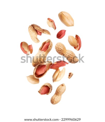 Tasty crushed peanuts in the air isolated on a white background Royalty-Free Stock Photo #2299960629