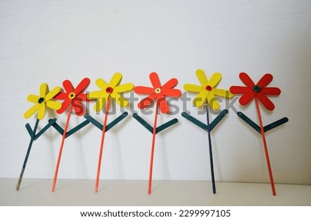 DIY Art and craft colourful popsicles sticks, painted in different colors and make into beautiful flowers. Satisfying hobby 