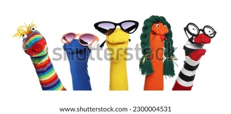 Many colorful sock puppets on white background, collage design Royalty-Free Stock Photo #2300004531