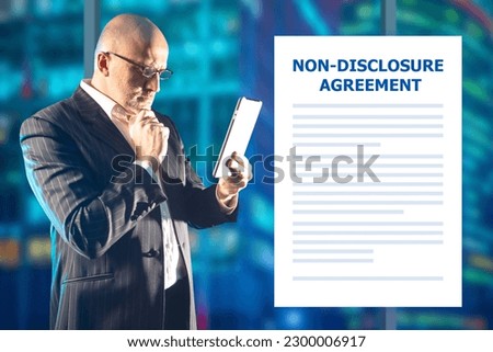 Nda contract. Man reads document. Non-disclosure agreement. Man with tablet. Nda contract when applying for job. Businessman enters into nda agreement. Non-disclosure agreement document