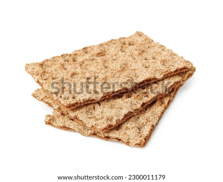 Many fresh crunchy crispbreads on white background. Healthy snack Royalty-Free Stock Photo #2300011179