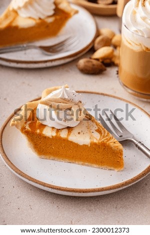 Pumpkin pie with cheesecake swirl, traditional dessert variation for Thanksgiving