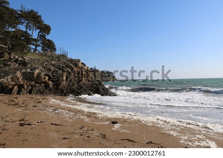 Waves on the beach , Etables Sur Mer in Brittany Royalty-Free Stock Photo #2300012761