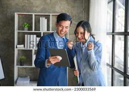 oung Asian business team creative businesspeople coworker, teamwork celebrating achievement and in planning design in creative in office

 Royalty-Free Stock Photo #2300033569