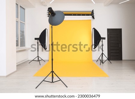 Interior of modern photo studio with professional lighting equipment Royalty-Free Stock Photo #2300036479