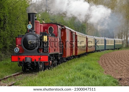 Steam locomotive in the countryside   Royalty-Free Stock Photo #2300047511