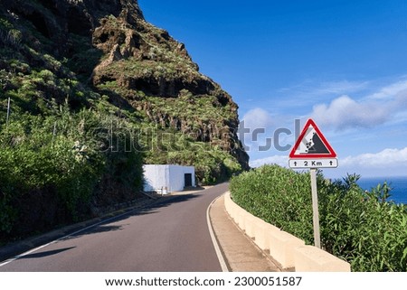 Dangerous mountain road in the rocks overlooking the ocean