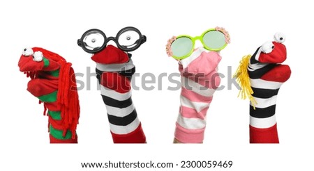 Many colorful sock puppets on white background, collage design Royalty-Free Stock Photo #2300059469