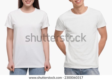 People wearing casual t-shirts on white background, closeup. Mockup for design Royalty-Free Stock Photo #2300060317