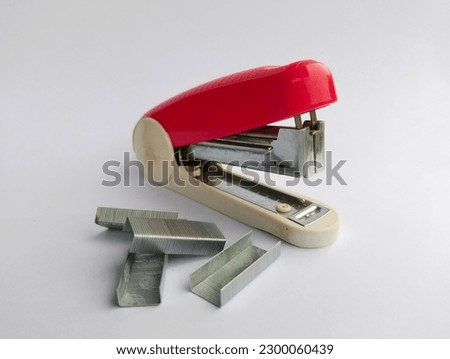 paper plugs are red as well as white on a plain white background