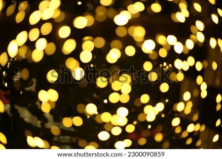 blur bokeh circus tube lamp hang from ceiling in dark room like firefly Royalty-Free Stock Photo #2300090859