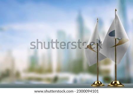 Small flags of the Eurasian Economic Union on an abstract blurry background. Royalty-Free Stock Photo #2300094101