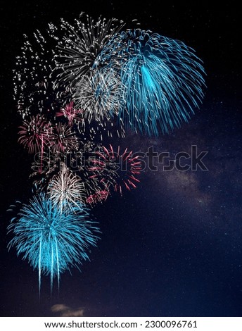 Red and Blue Firework with blur milky way background