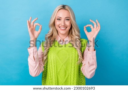 Portrait of pretty girl worker hold hands showing okey symbols approve wear elegant clothes isolated blue color background