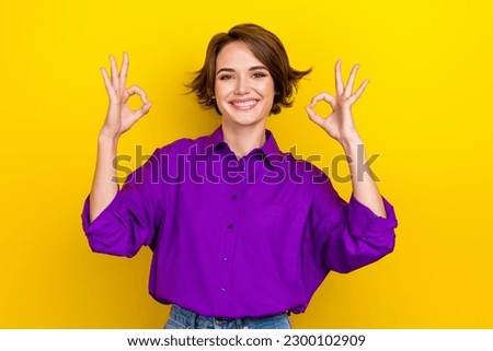 Photo of pretty businesswoman show okey symbols two hands good mood wear elegant blouse isolated yellow color background