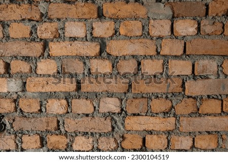 Red Brick wall masonry background. Construction bricks.