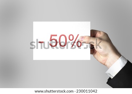 businessman hand holding card fifty percent discount