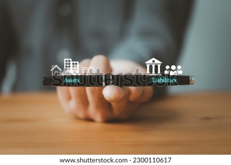 Balance sheet with assets and liabilities on pen Royalty-Free Stock Photo #2300110617