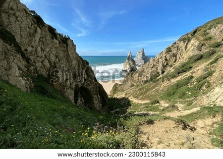 Panorama of the ocean coast and rock bay, Atlantic Ocean in winter, beautiful cloudscape, dramatic landscape, colorful seascape with sheer rocks, travel content, Lisbon, Portugal