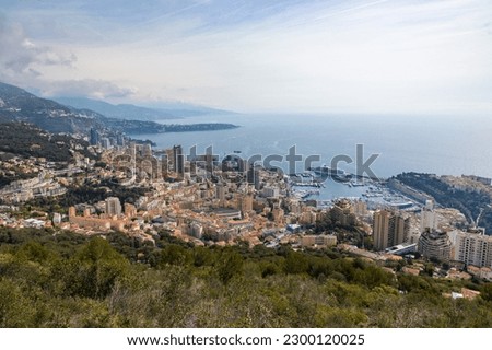 View of Monaco on a cloudy day from the hiking path leading to La Turbie